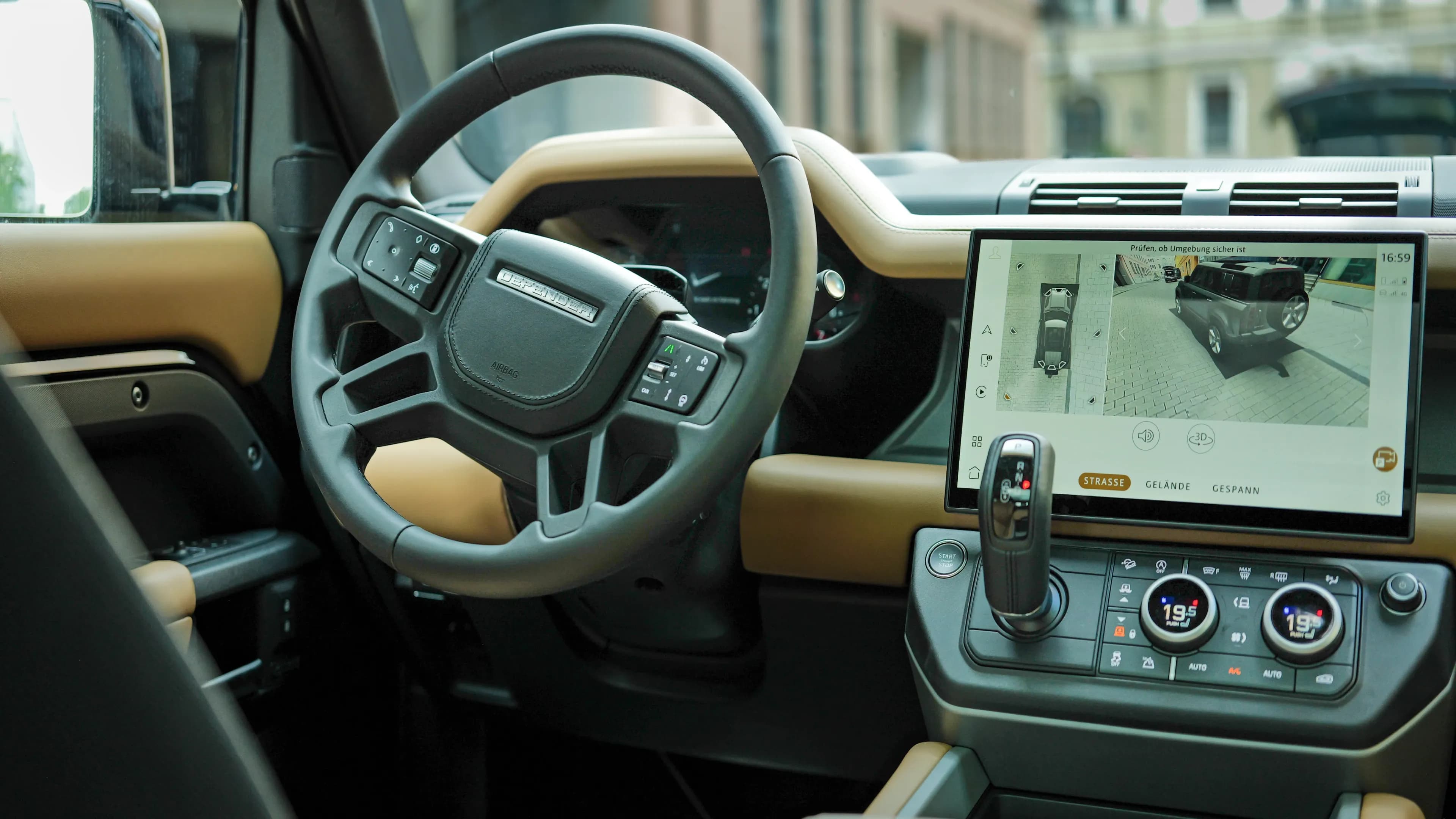Rent a Land Rover Defender V8 in Munich – iconic dashboard grab handle details with exposed screws inside the premium off-roader by Mosaik Motors.