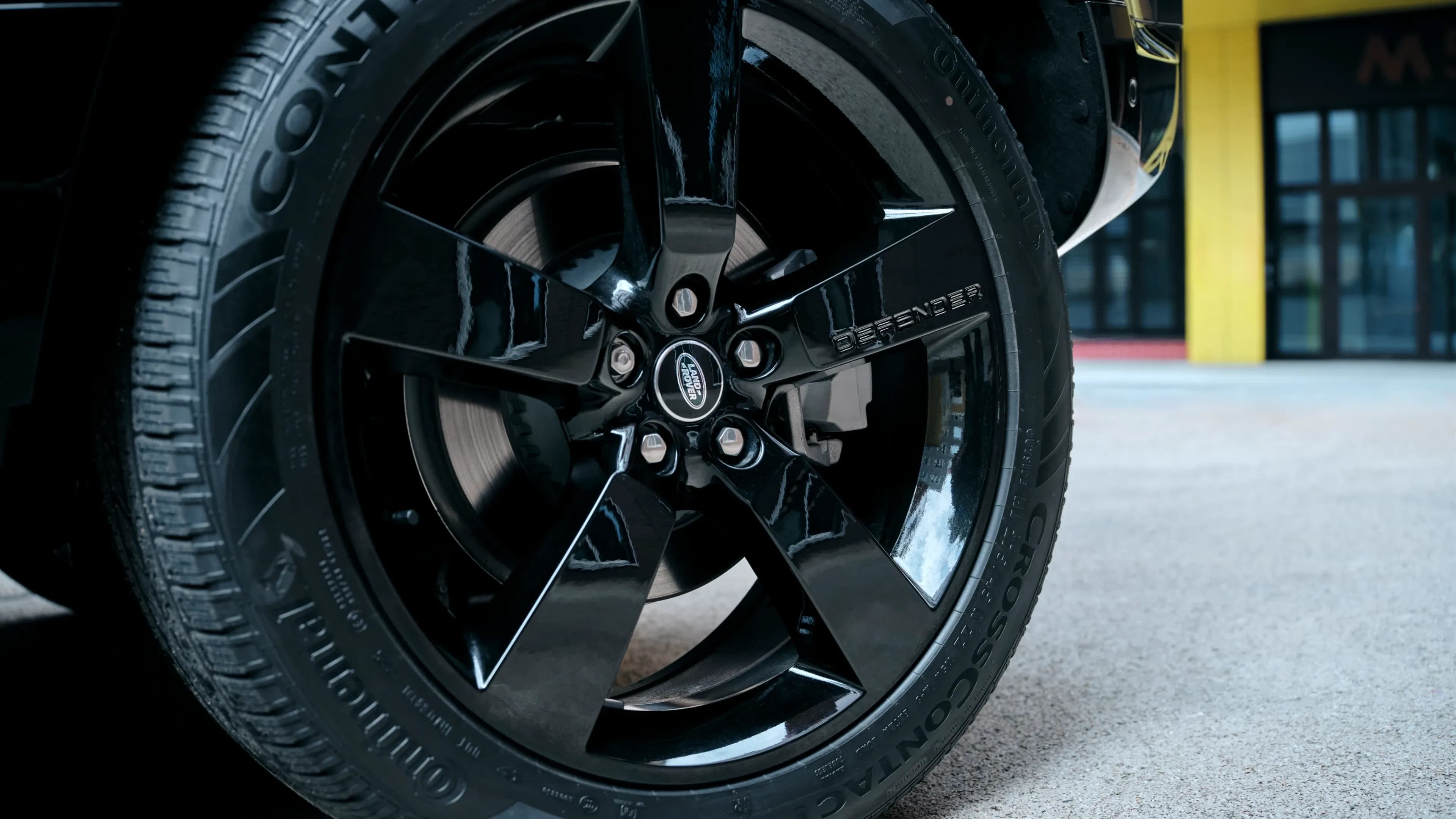 Land Rover Defender gloss black alloy wheel with Continental tyre close-up