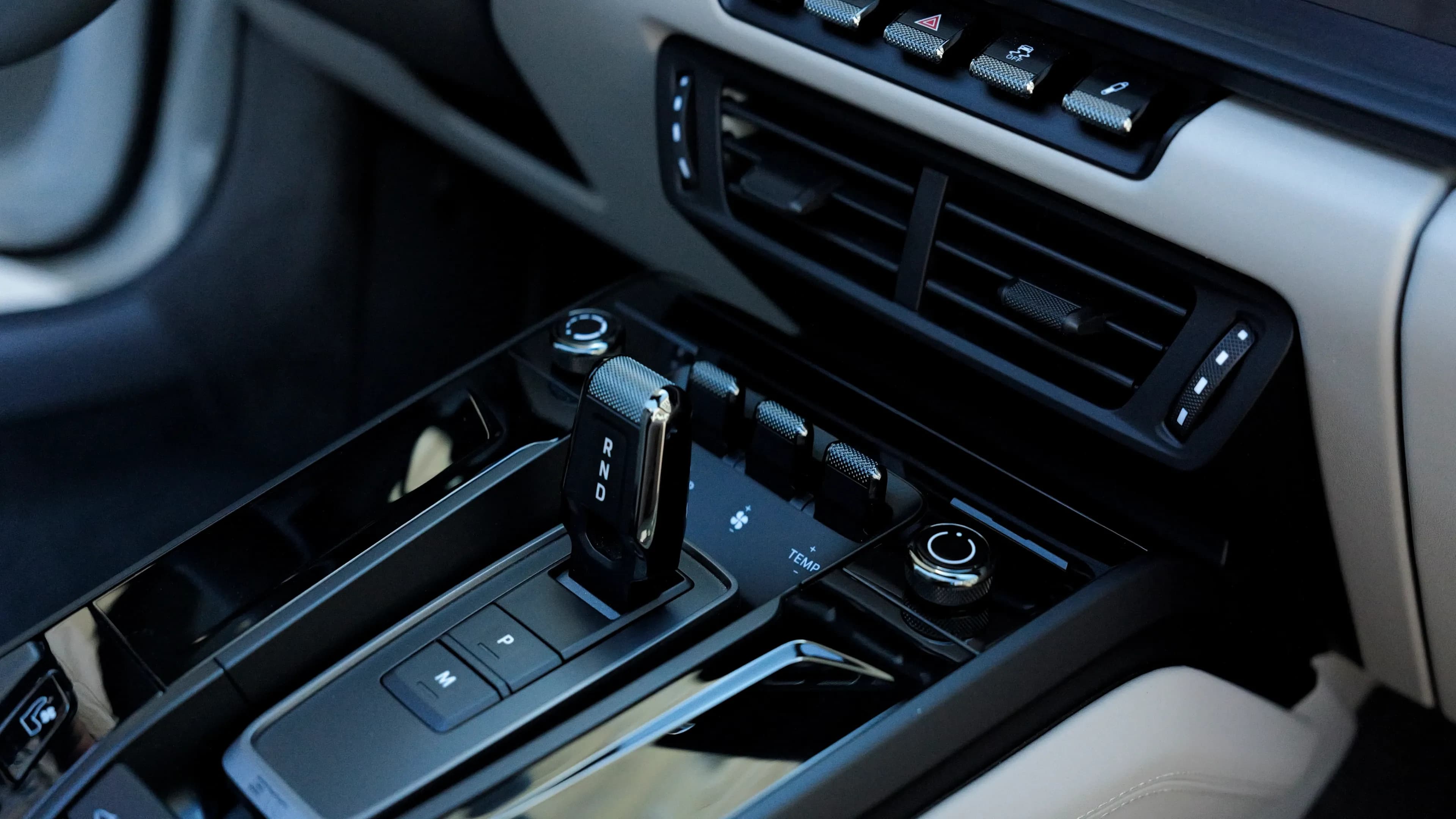 Elegant center console with PDK gear selector and controls inside the Porsche 911 Targa 4 GTS.