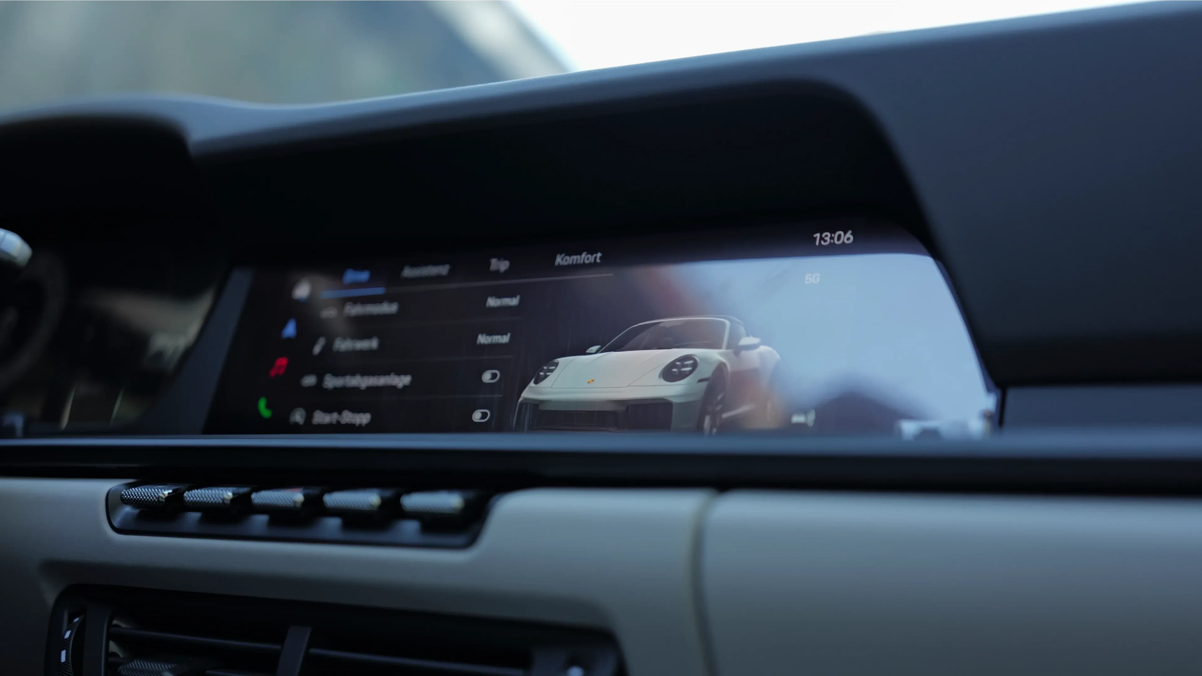 Digital infotainment system in the Porsche Targa 911 showing driving profile settings at Mosaik Motors luxury car rental.
